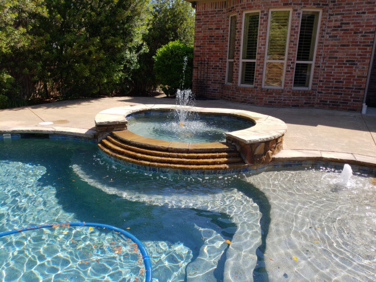 Water feature next to a pool
