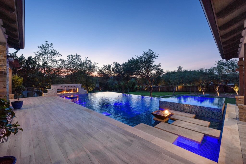 Decorative decking with blue tile pool