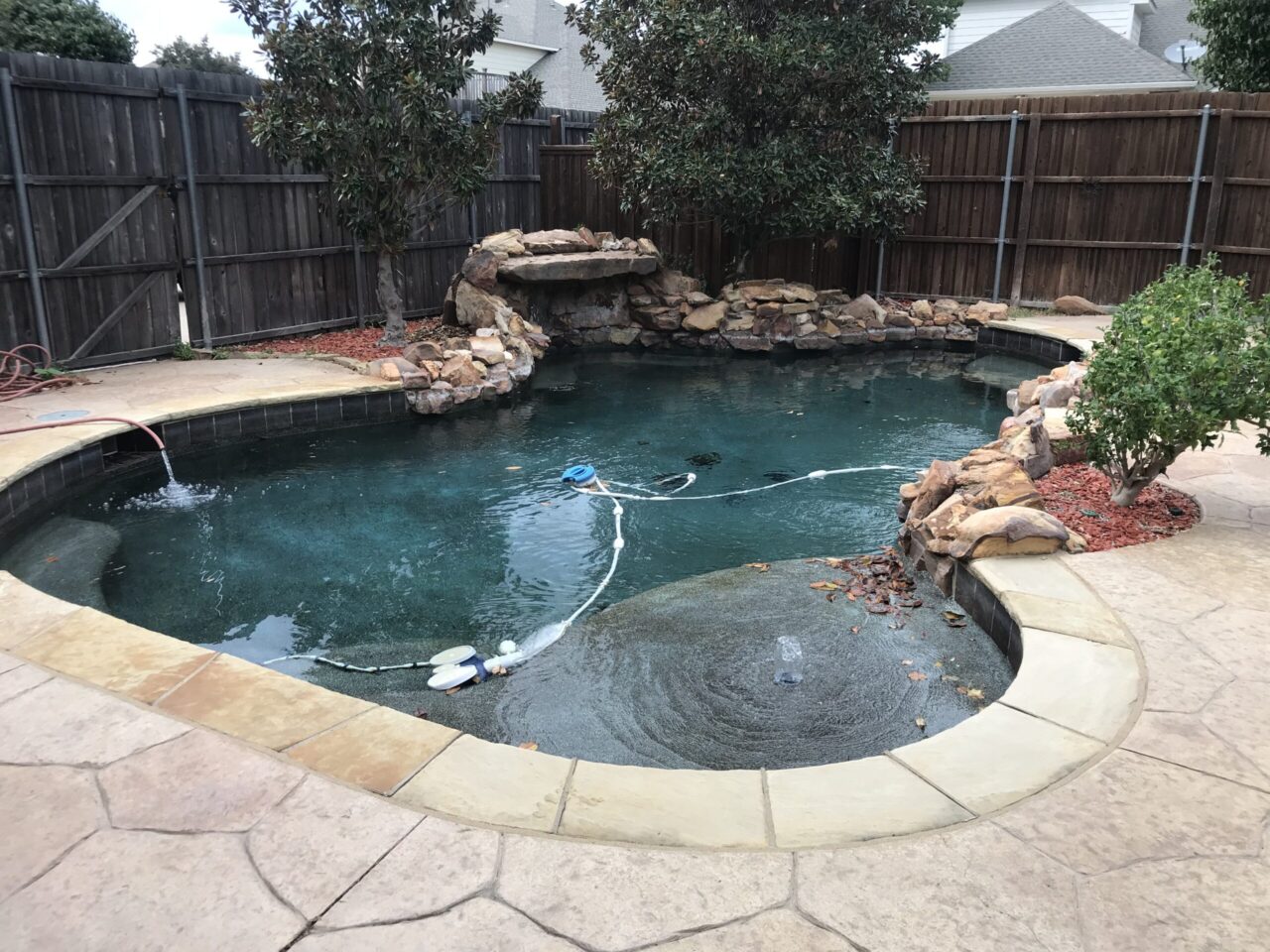 Sunshelf next to clean pool with new decking after Green to clean service and fencing